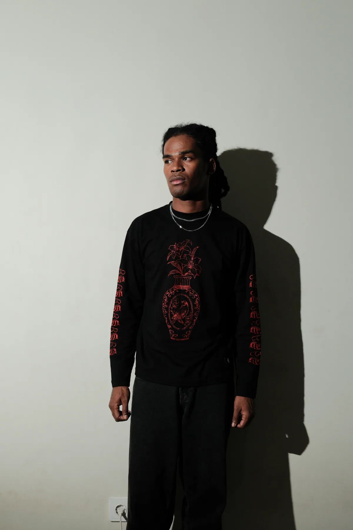 Model wearing the black Porcelain graphic long sleeve.